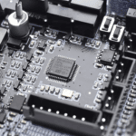 EMU SLB close-up 2 Close-up of a circuit board featuring an STM32G0B1 microcontroller chip surrounded by surface-mount components and connectors